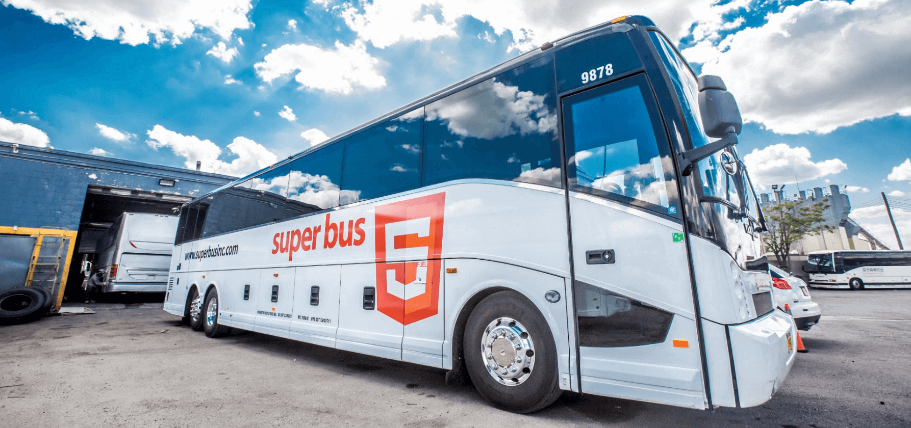 Superbusinc.com charter busses Picture of a Superbus inc. bus showing a variation of the HTML5 logo